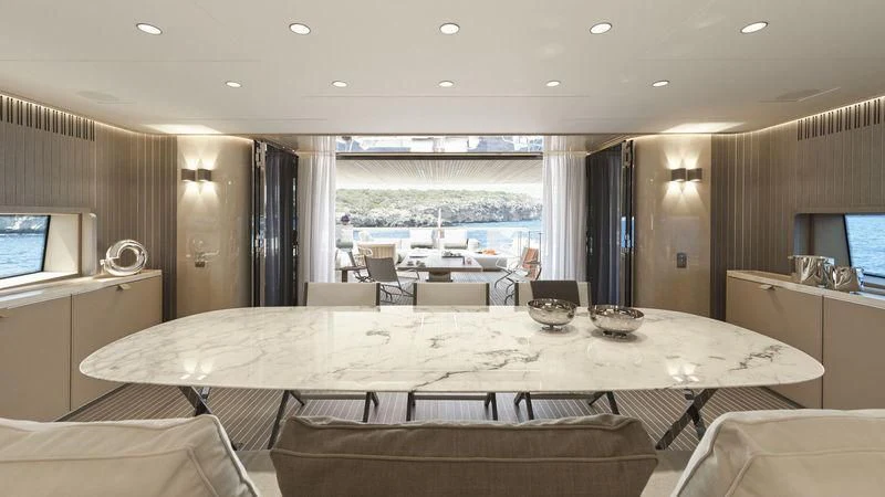 a room with a table and chairs aboard LADY KATHLEEN Yacht for Sale