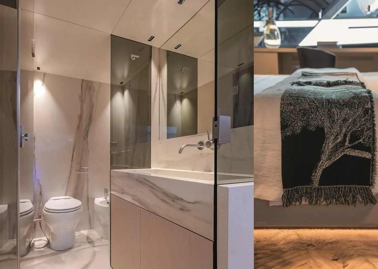 a bathroom with a bathtub and toilet aboard NADA Yacht for Sale