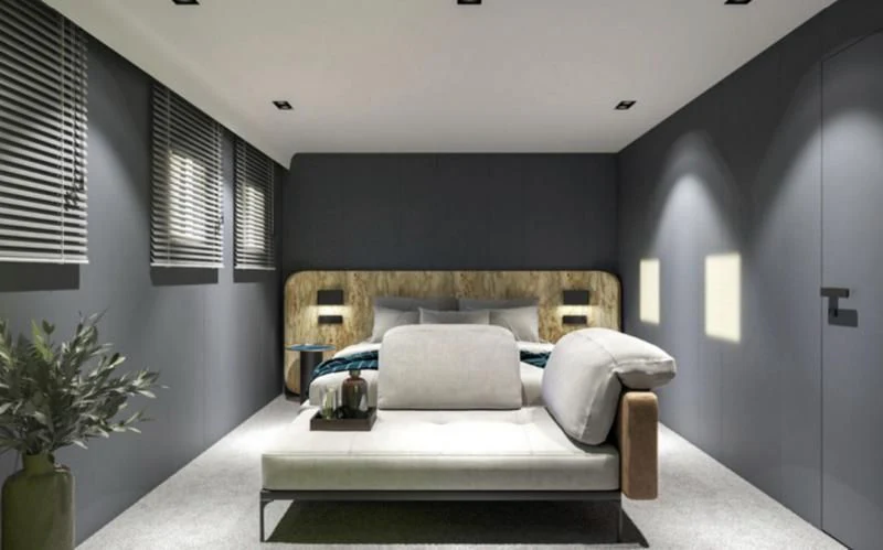 a room with a bed and a plant aboard ANETTA Yacht for Charter