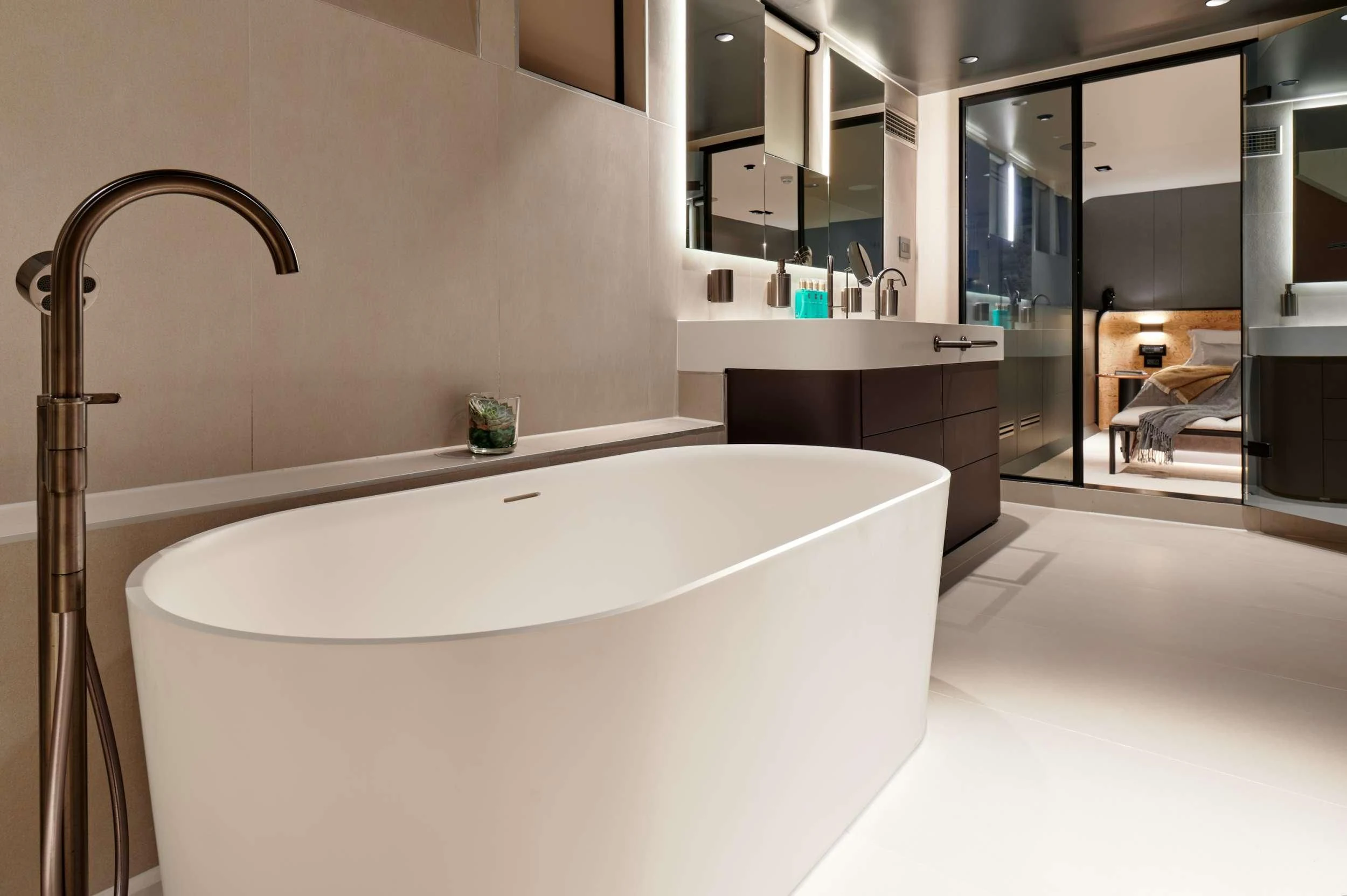 a large white bathtub in a bathroom aboard ANETTA Yacht for Charter