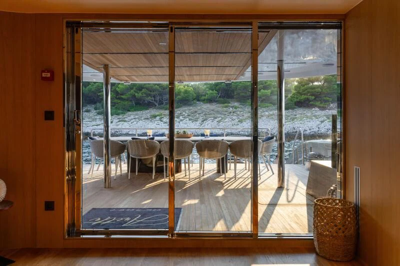 a room with a table and chairs aboard ANETTA Yacht for Charter