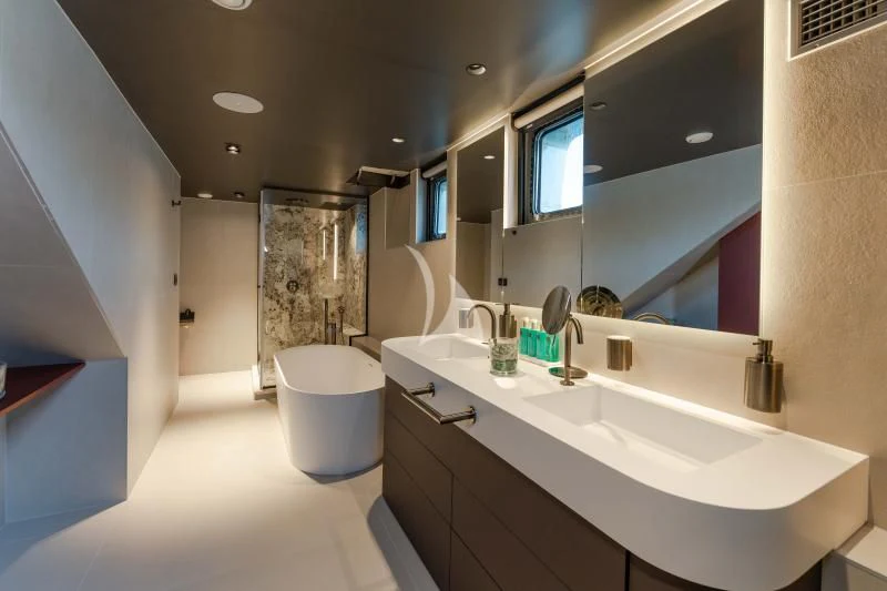 a bathroom with a large mirror aboard ANETTA Yacht for Charter