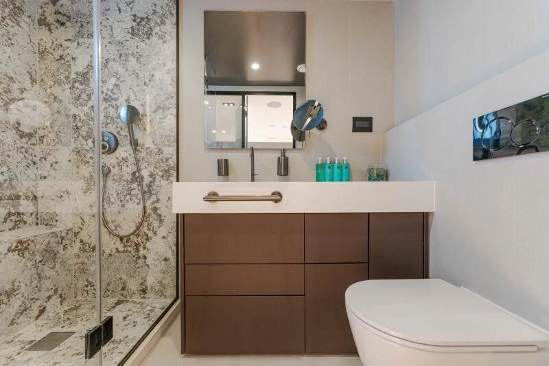 a bathroom with a shower and toilet aboard ANETTA Yacht for Charter
