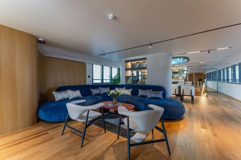 a living room with a couch and a table aboard ANETTA Yacht for Charter
