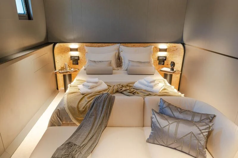 a bed with pillows and pillows aboard ANETTA Yacht for Charter