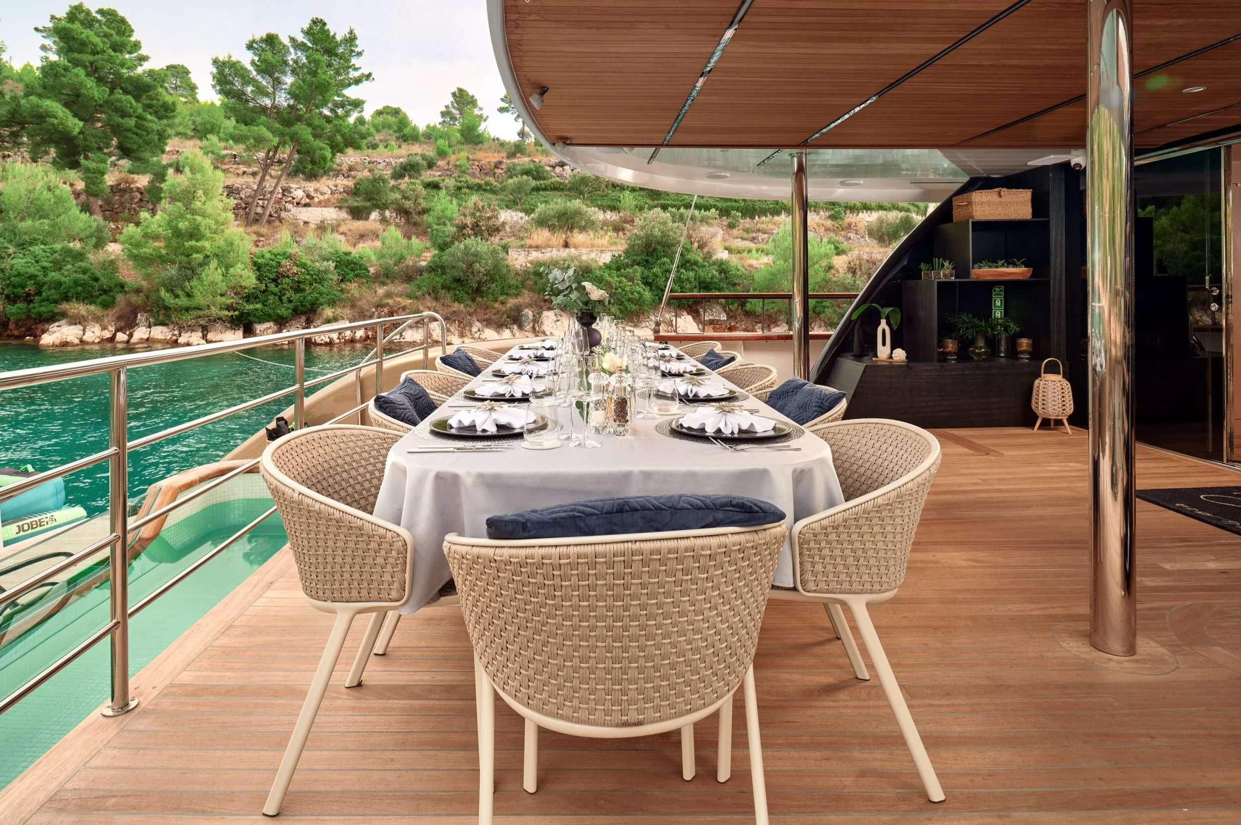 a table and chairs on a patio aboard ANETTA Yacht for Charter
