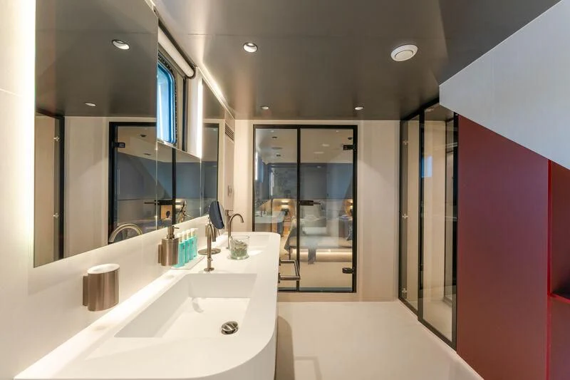a bathroom with a sink and a mirror aboard ANETTA Yacht for Charter
