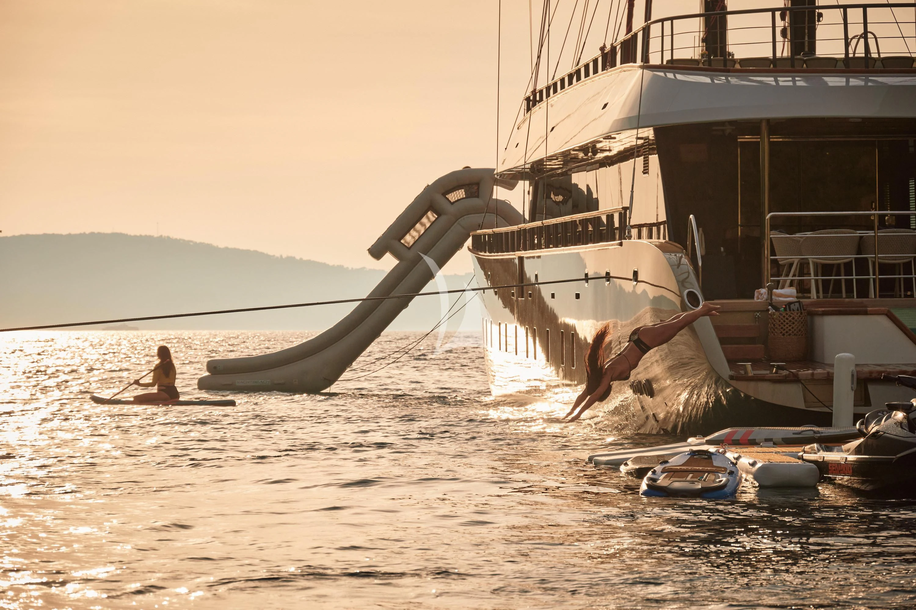 a large whale jumping out of the water aboard ANETTA Yacht for Charter