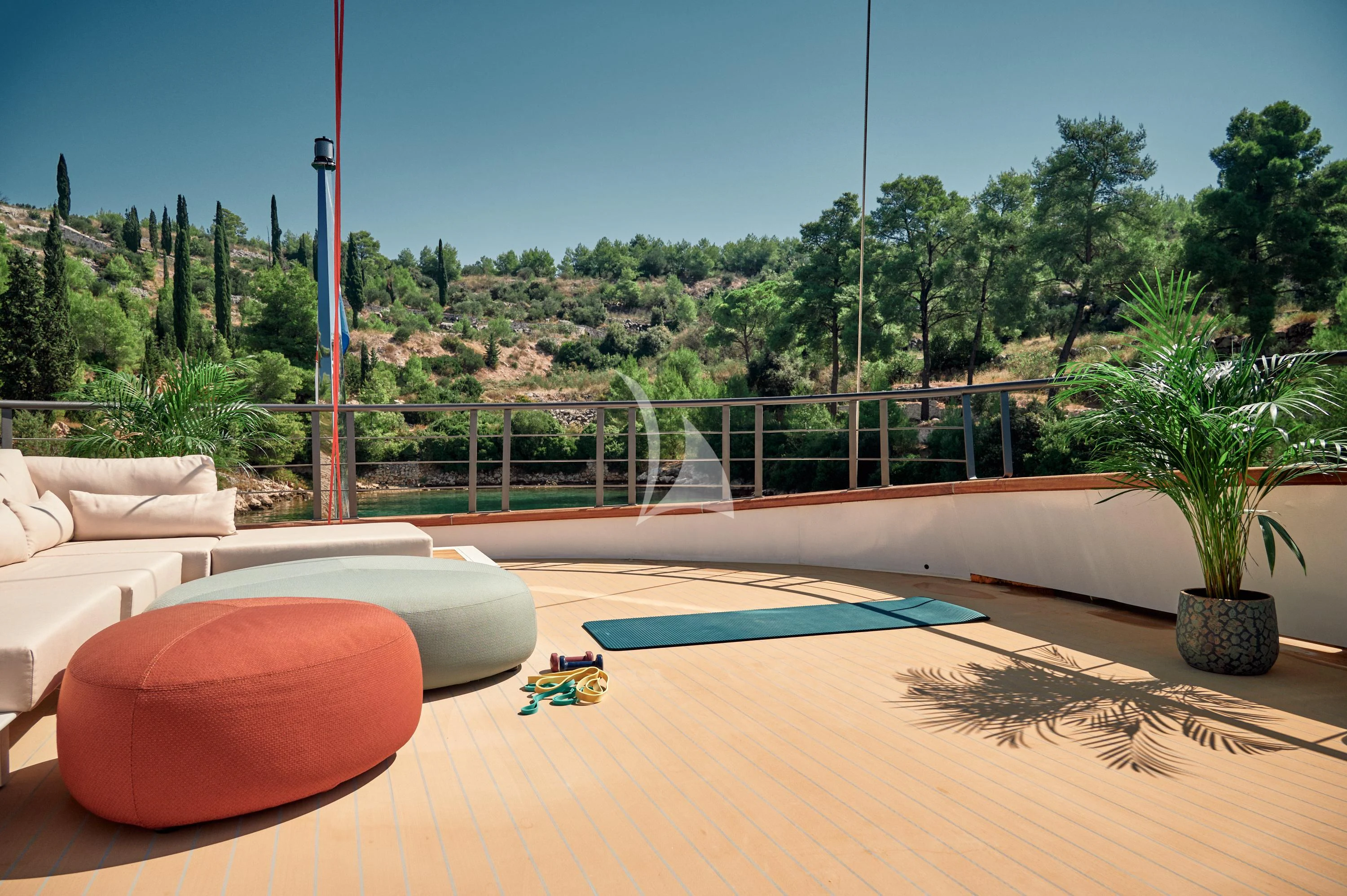 a table with a toy and a plant on it aboard ANETTA Yacht for Charter