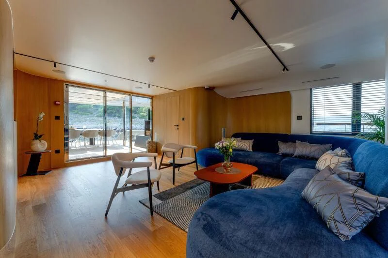 a living room with a couch and a table aboard ANETTA Yacht for Charter