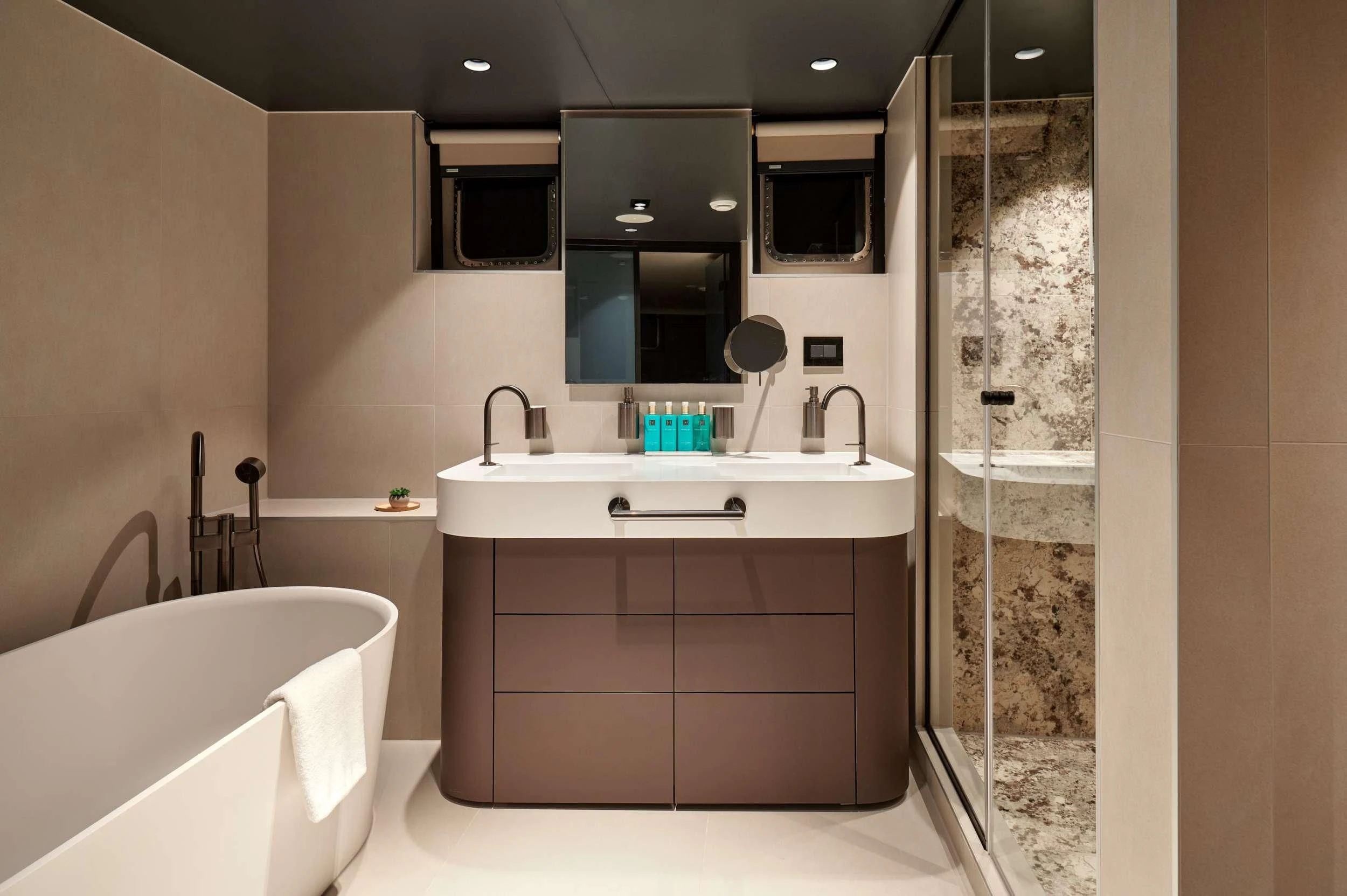 a bathroom with a sink and bathtub aboard ANETTA Yacht for Charter