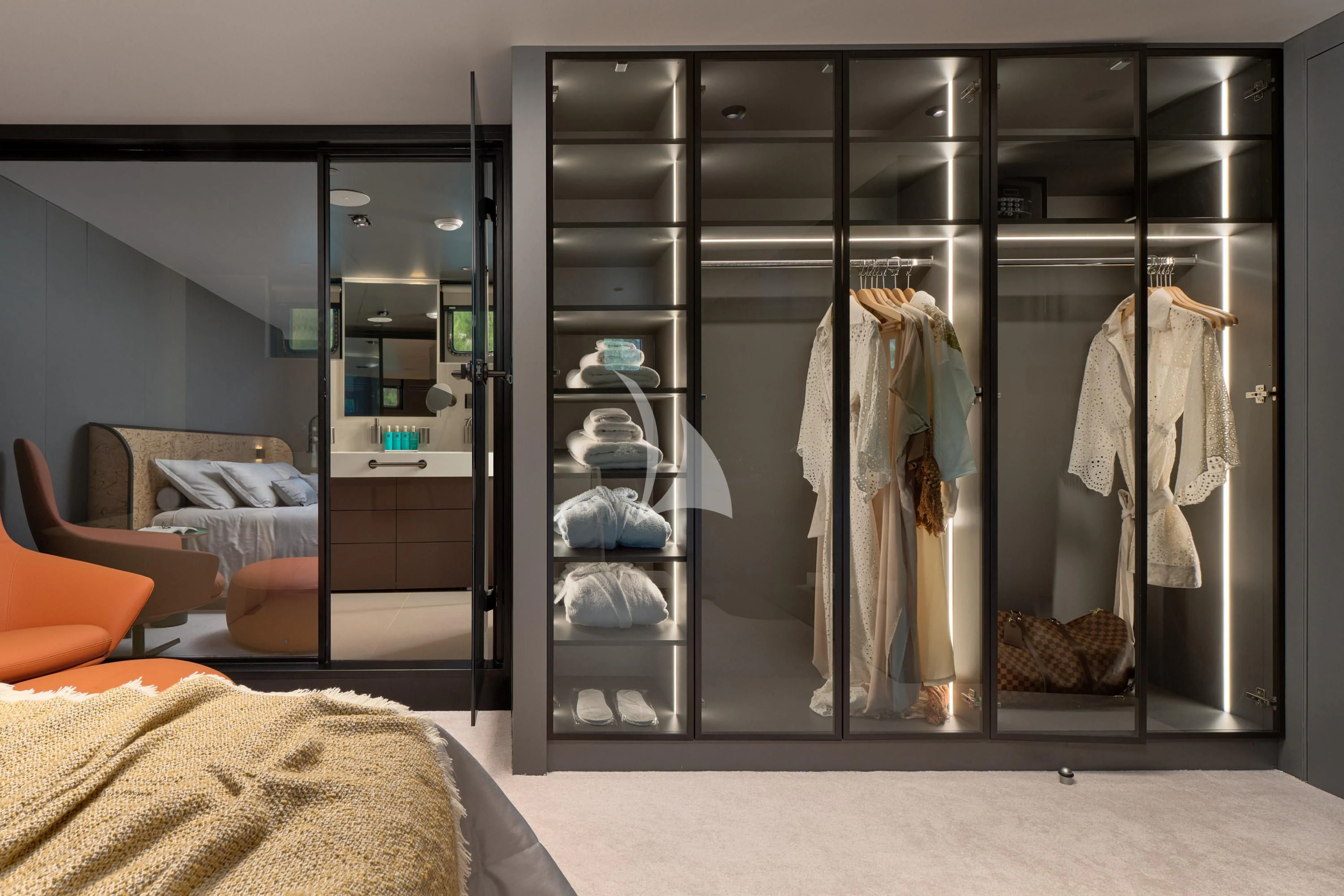 a closet with clothes and shoes aboard ANETTA Yacht for Charter