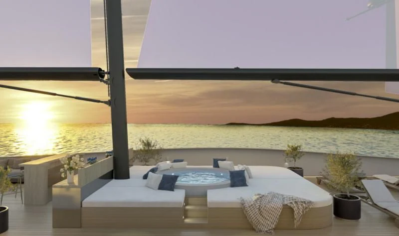 a large white lounge chair in a room with a large flat roof aboard ANETTA Yacht for Charter