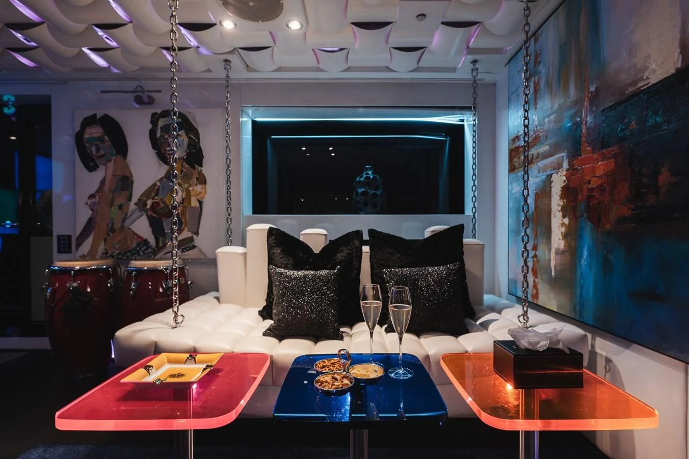a living room with a large screen aboard MAJESTY ELENOLIYA Yacht for Sale