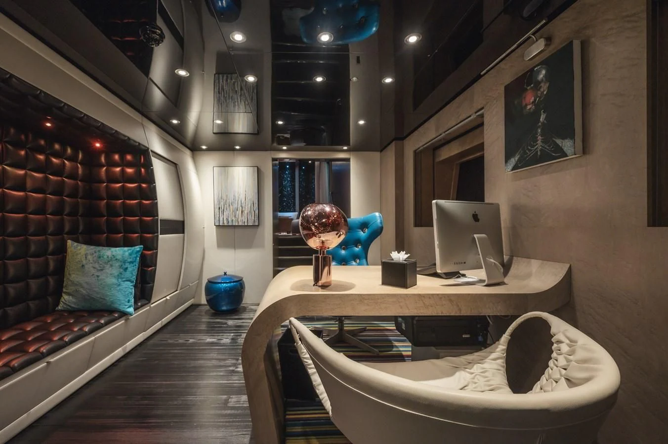 a room with a bed and a desk aboard MAJESTY ELENOLIYA Yacht for Sale