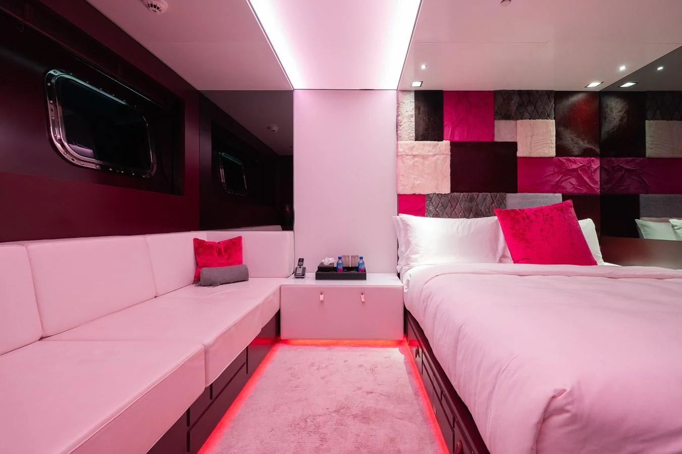 a room with beds and a red rug aboard MAJESTY ELENOLIYA Yacht for Sale