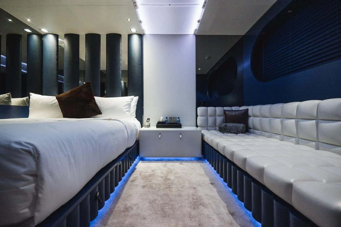 a room with beds and a window aboard MAJESTY ELENOLIYA Yacht for Sale