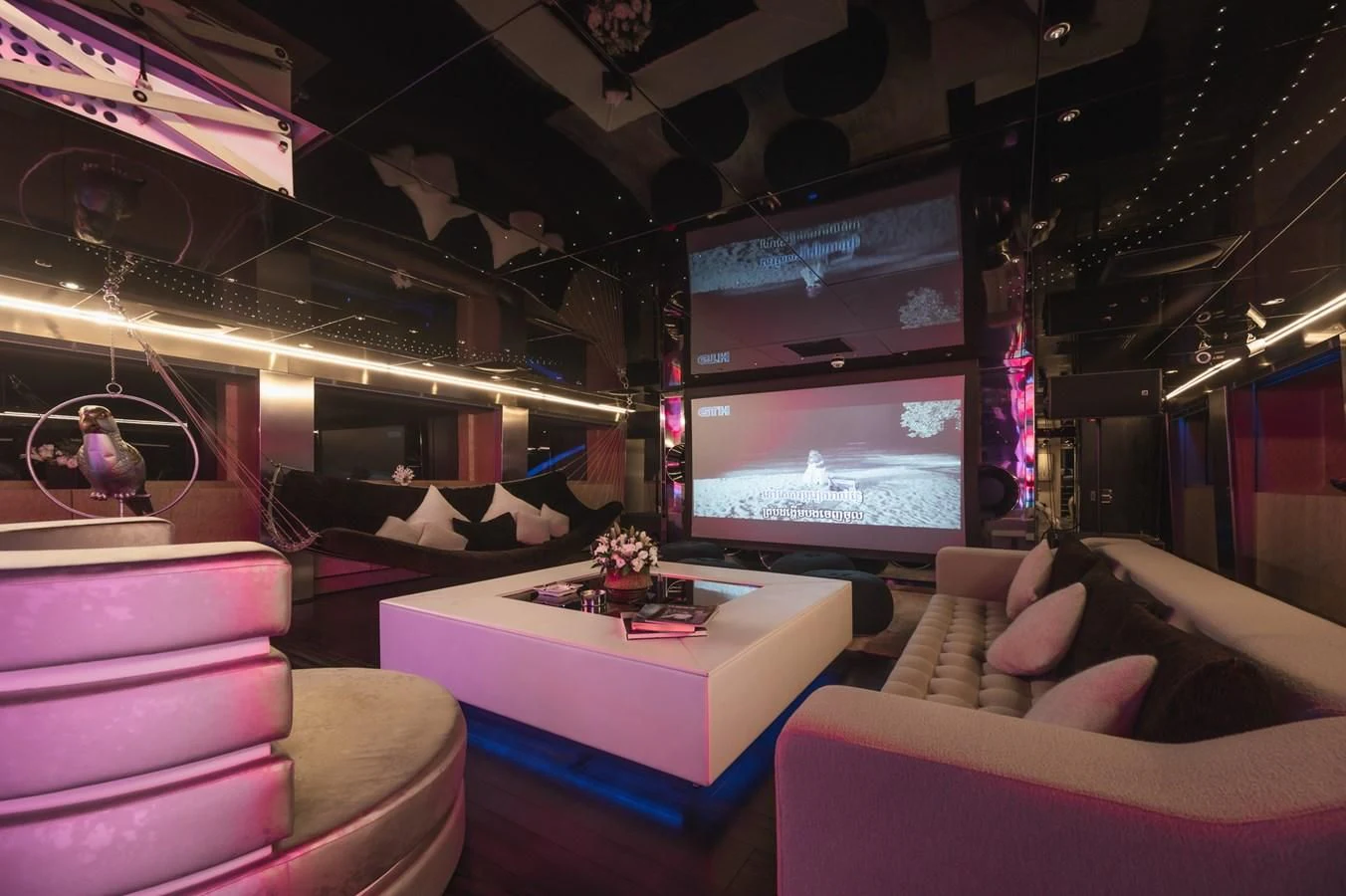 a room with a tv and a couch aboard MAJESTY ELENOLIYA Yacht for Sale