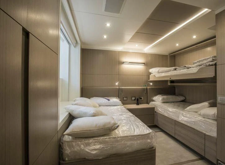 a room with a bed and a shelf aboard ALEGRE Yacht for Sale