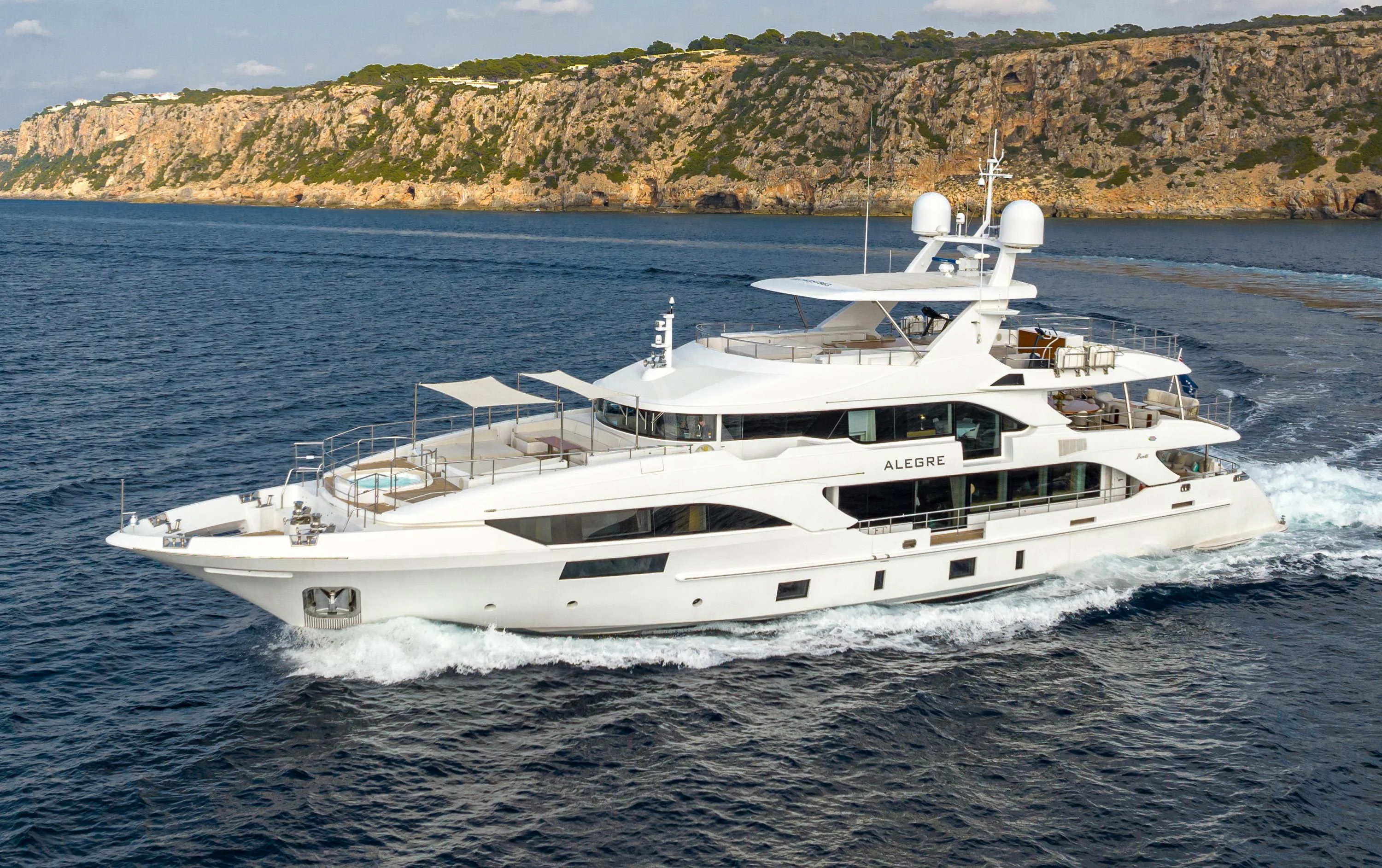 a white yacht on the water aboard ALEGRE Yacht for Sale