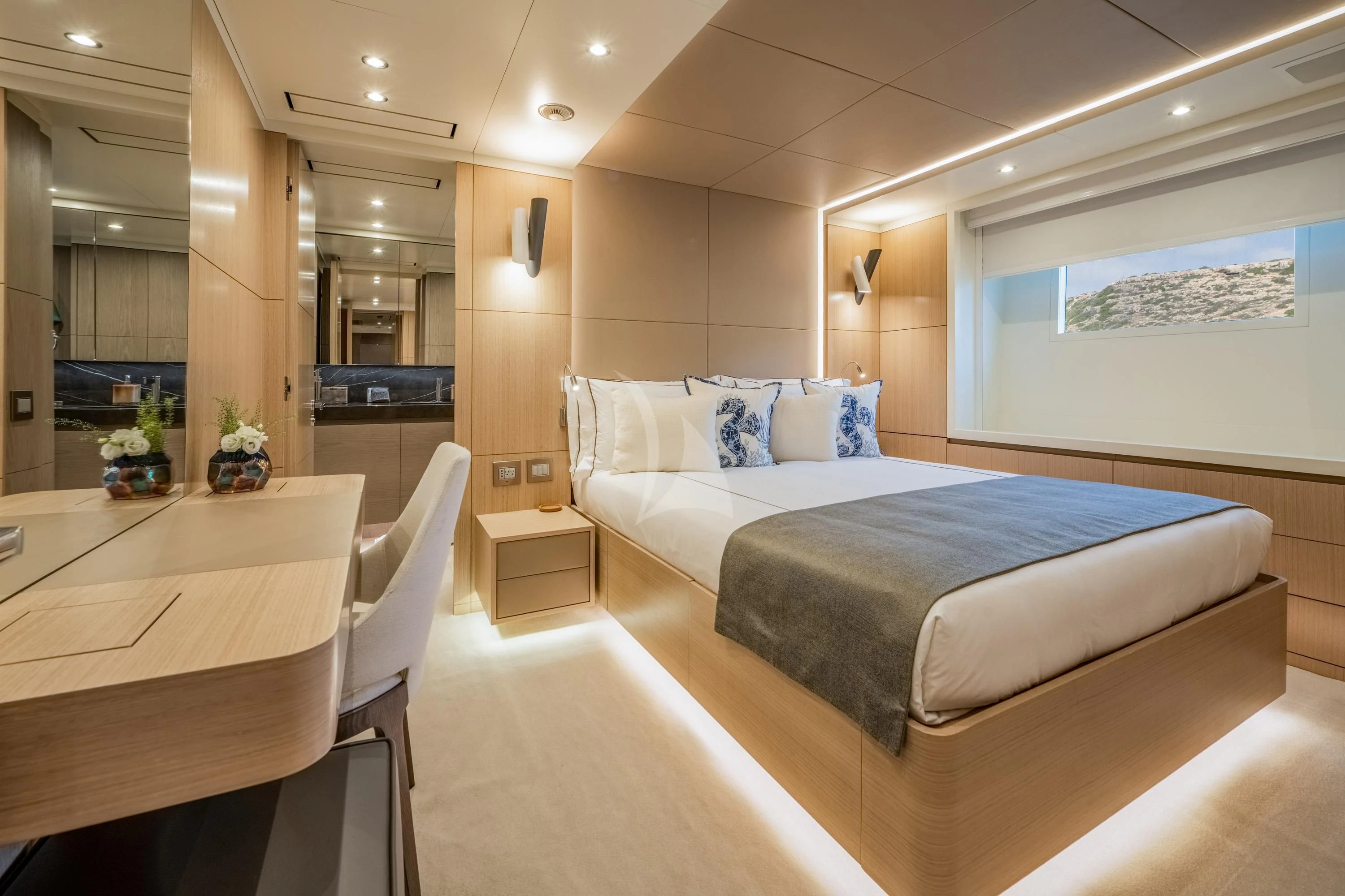 a room with a bed and a table aboard ALEGRE Yacht for Sale