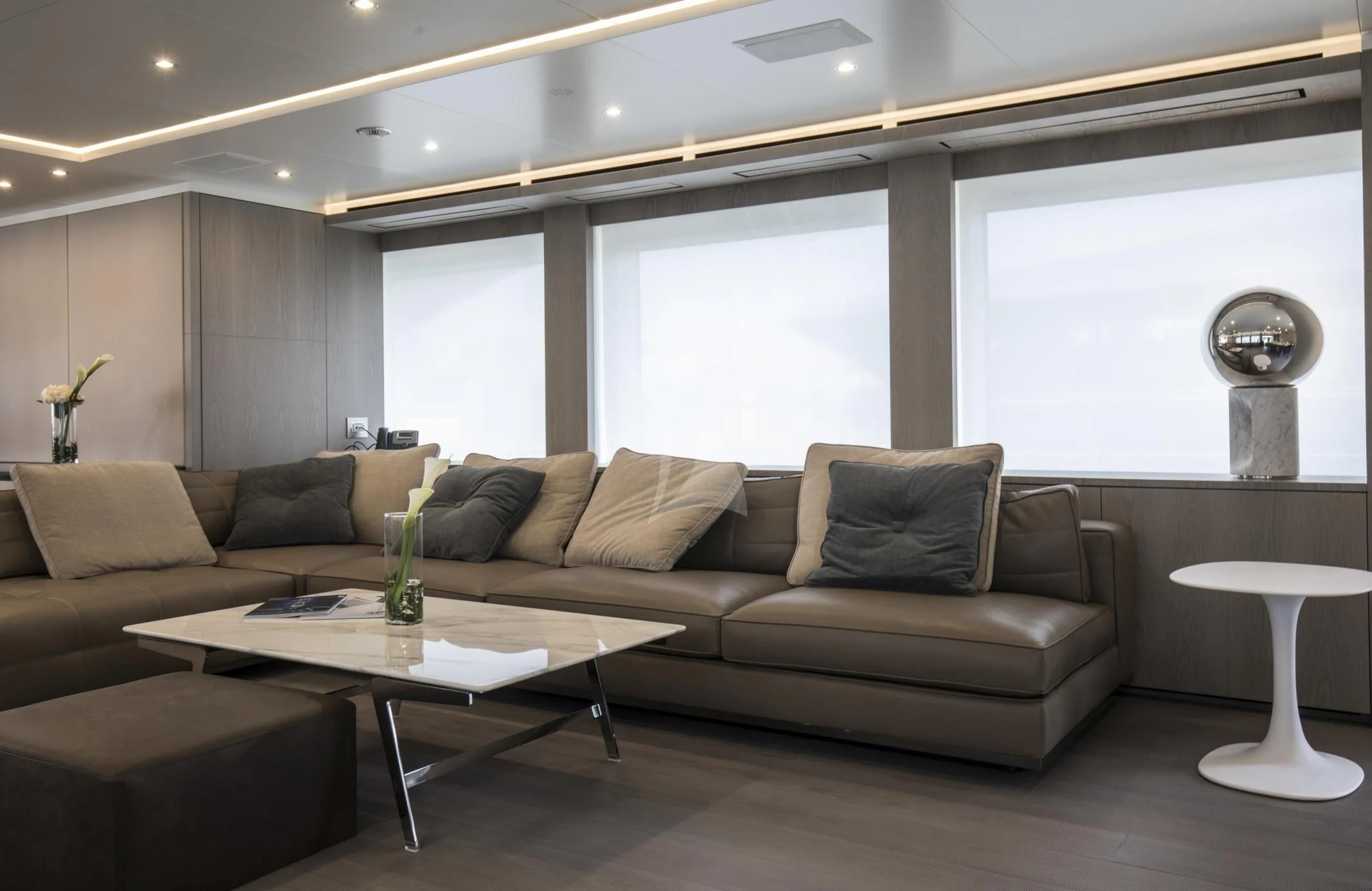 a living room with a couch and a coffee table aboard ALEGRE Yacht for Sale
