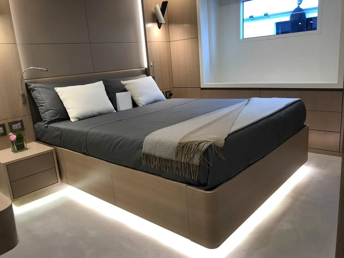 a bed with a black and white bed spread aboard ALEGRE Yacht for Sale
