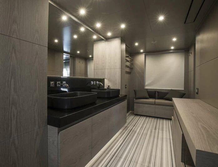 a kitchen with a sink and a couch aboard ALEGRE Yacht for Sale