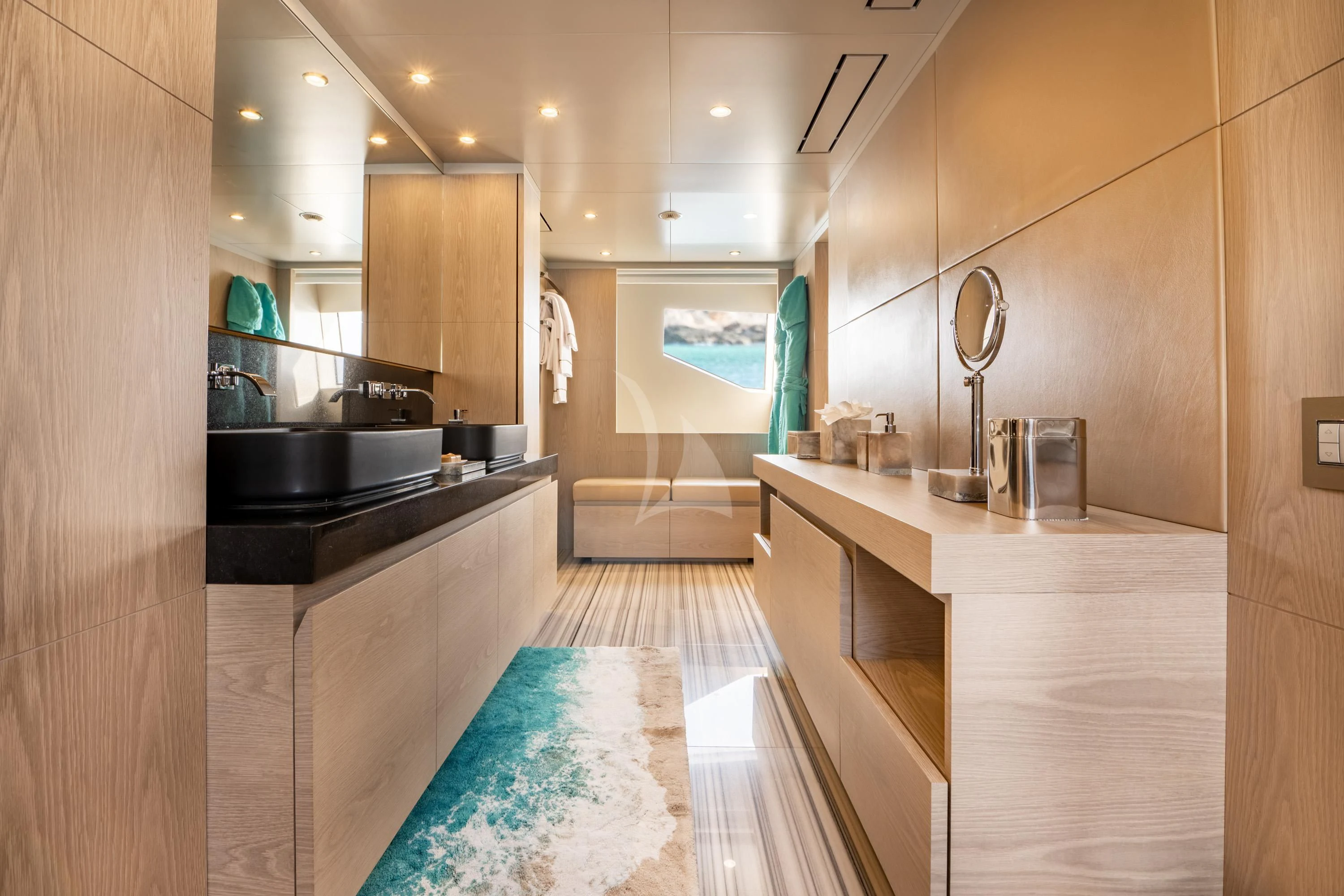 a bathroom with a large sink and a large mirror aboard ALEGRE Yacht for Sale