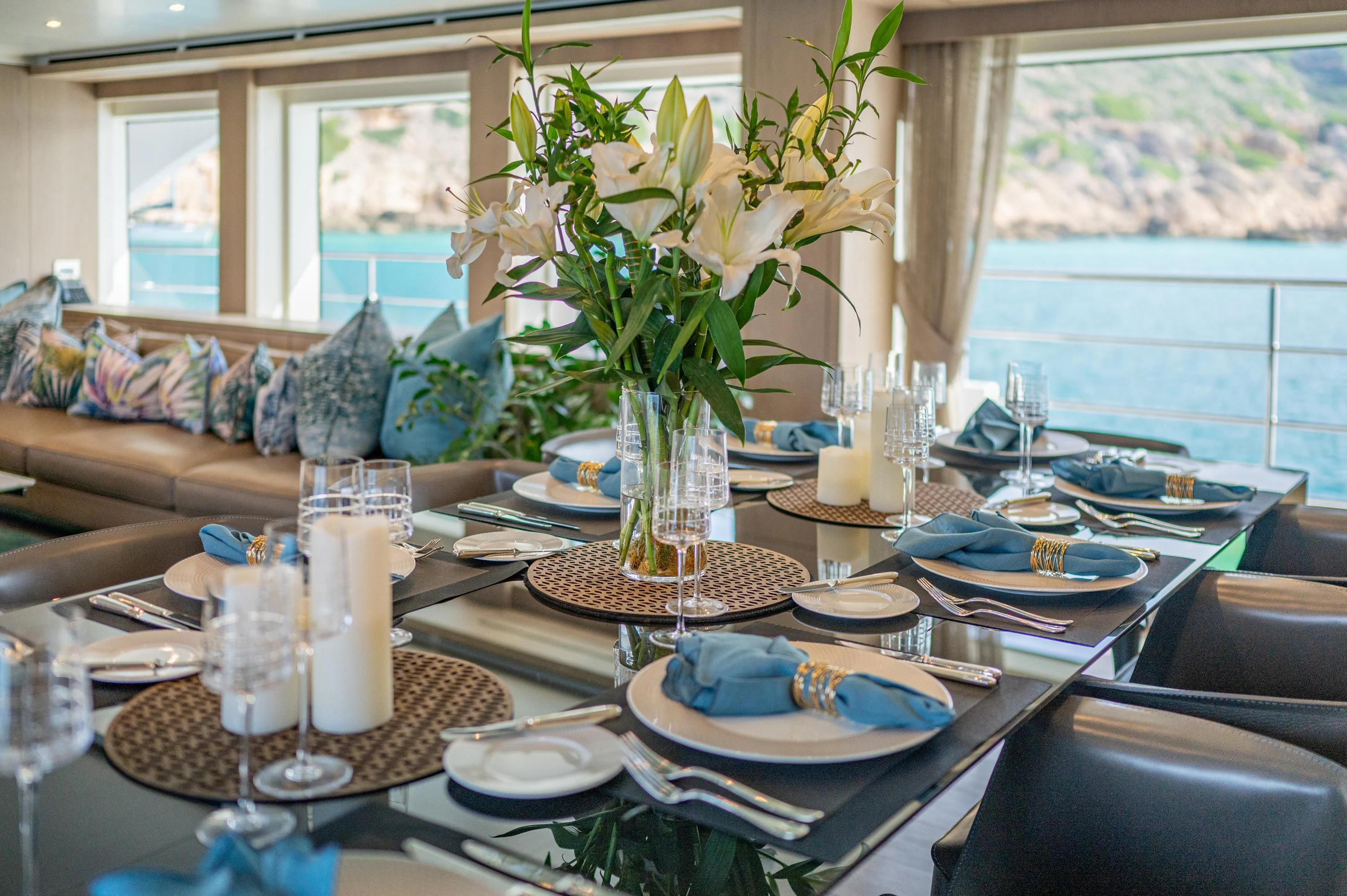 a table with plates and glasses aboard ALEGRE Yacht for Sale