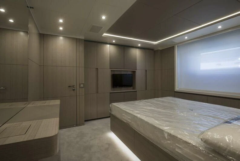 a room with a bed and a tv aboard ALEGRE Yacht for Sale