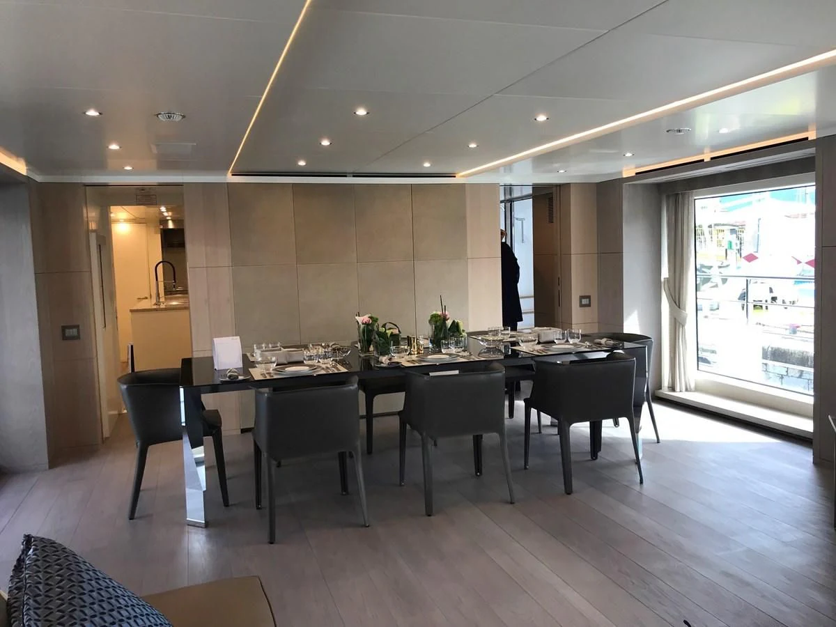 a large kitchen with a table and chairs aboard ALEGRE Yacht for Sale