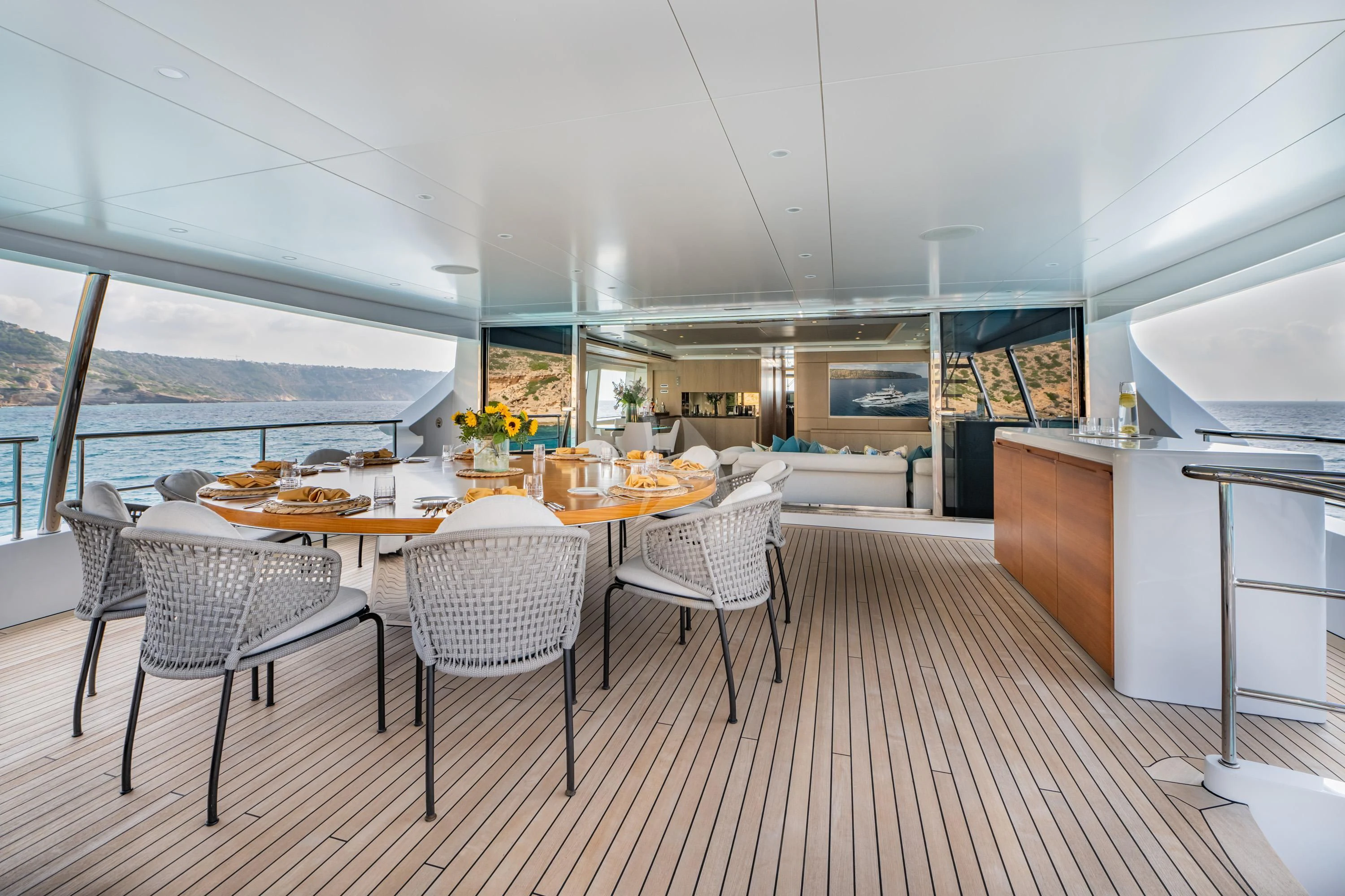 a large kitchen with a table and chairs aboard ALEGRE Yacht for Sale