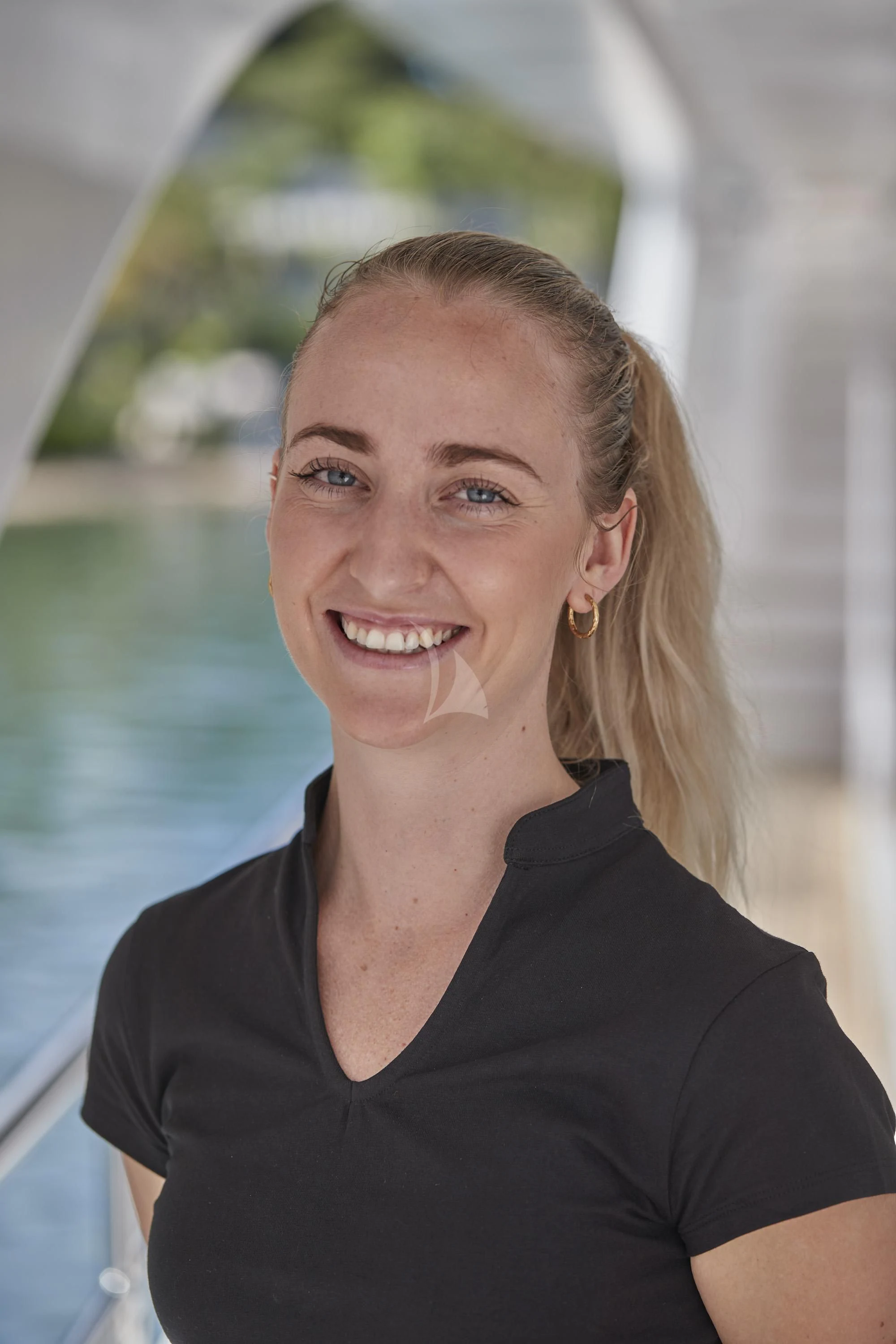 a woman smiling for the camera aboard ALEGRE Yacht for Sale