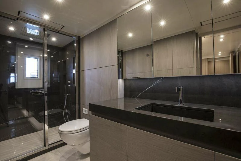 a bathroom with a glass shower aboard ALEGRE Yacht for Sale
