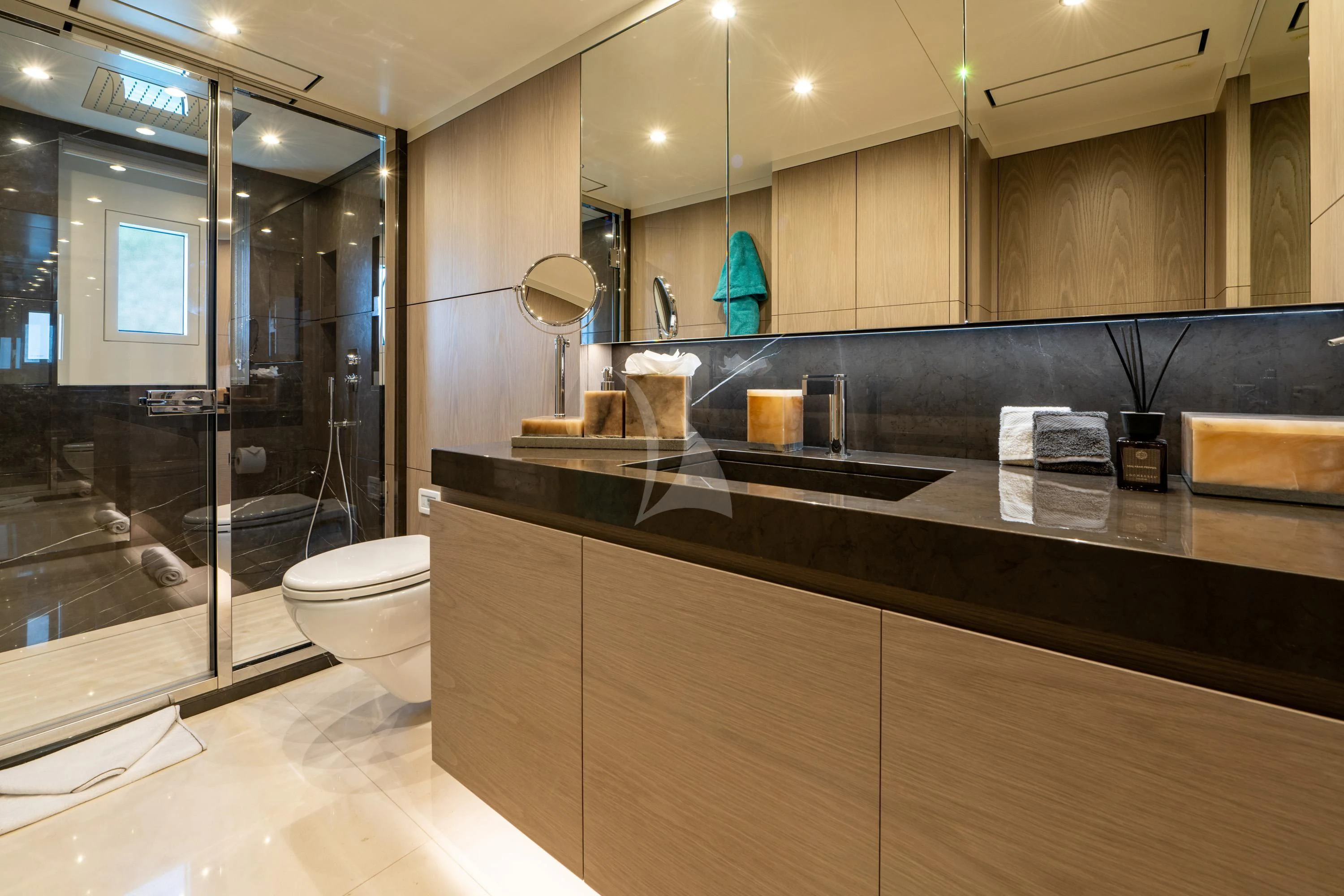 a bathroom with a glass shower aboard ALEGRE Yacht for Sale