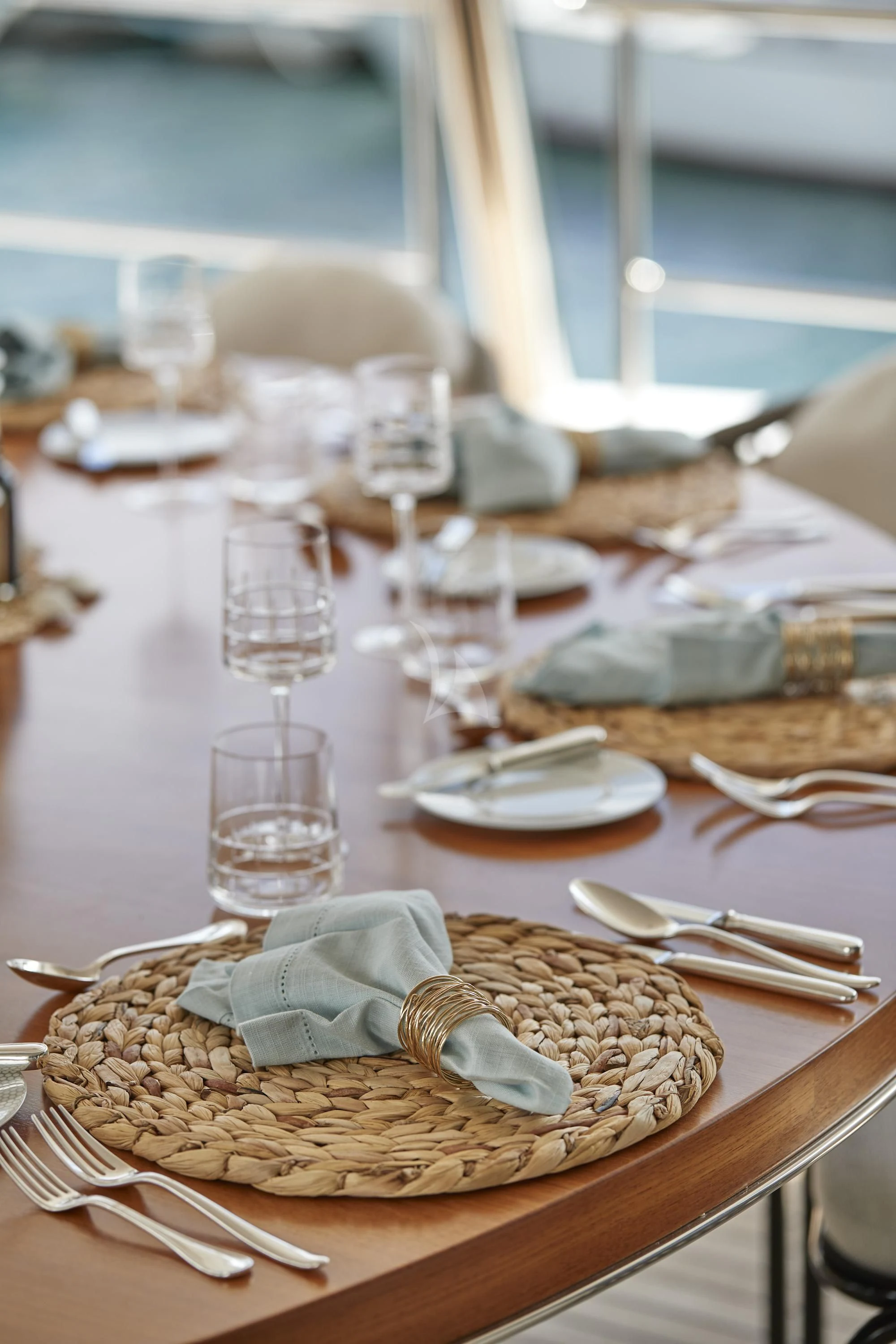 a table with a plate of food and glasses on it aboard ALEGRE Yacht for Sale