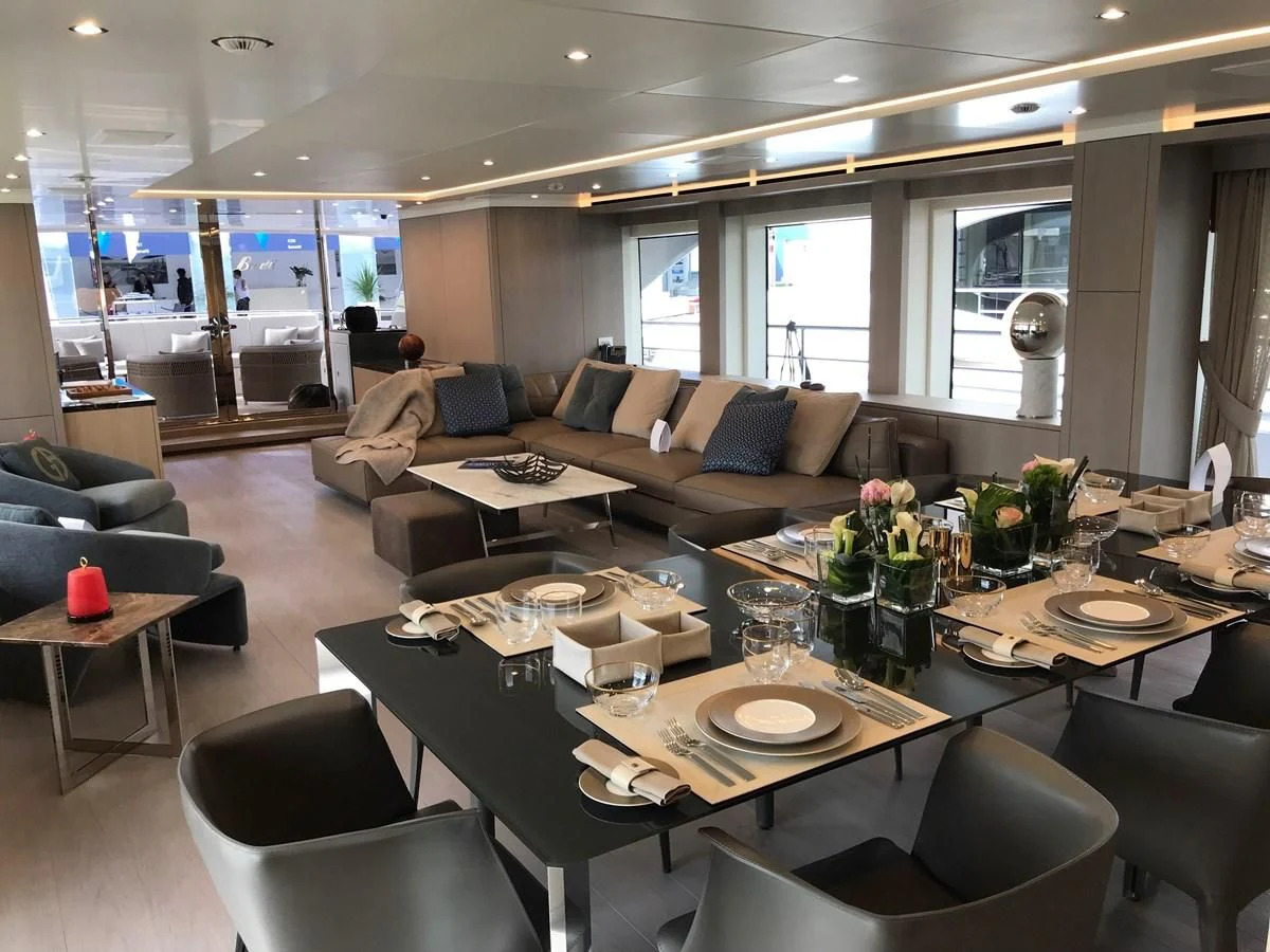 a large room with a table and chairs aboard ALEGRE Yacht for Sale