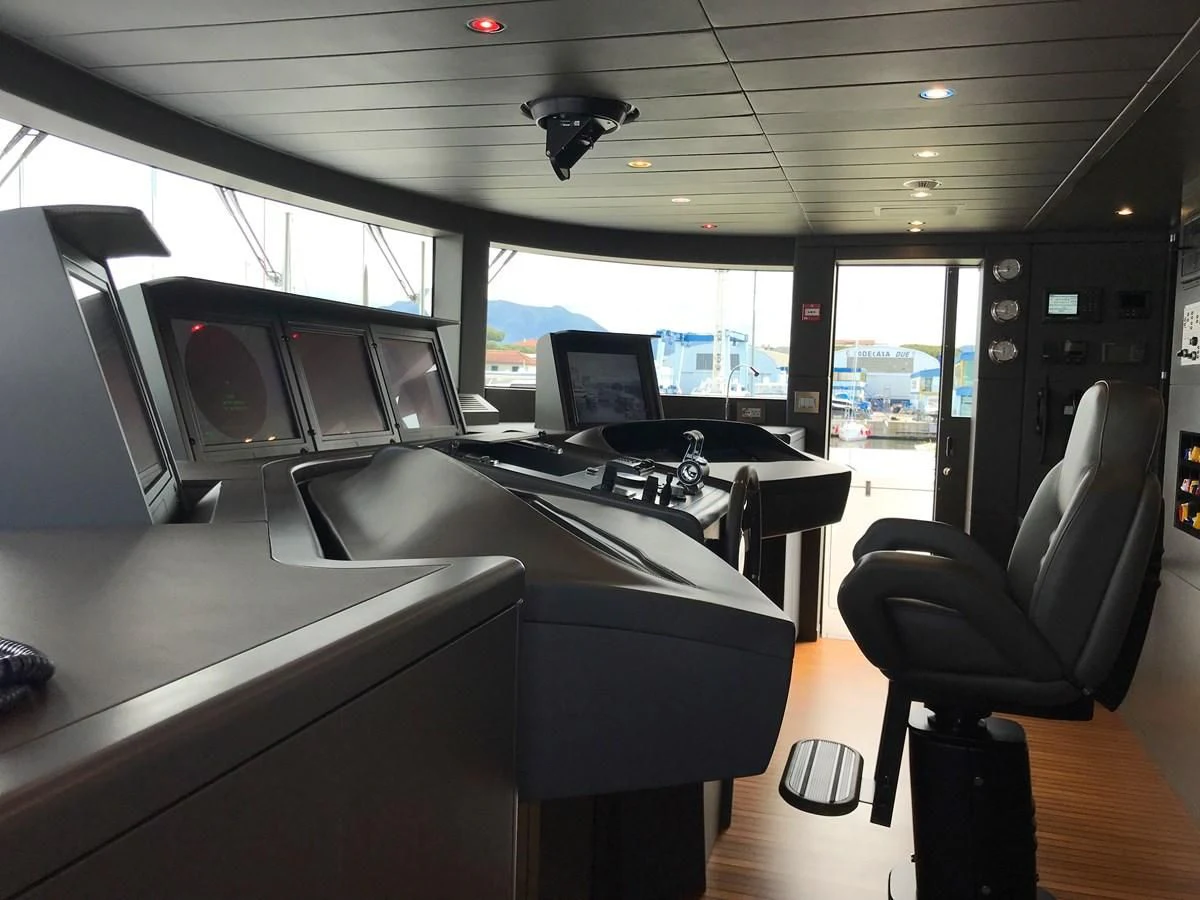 a room with a large window and a desk with computers on it aboard ALEGRE Yacht for Sale