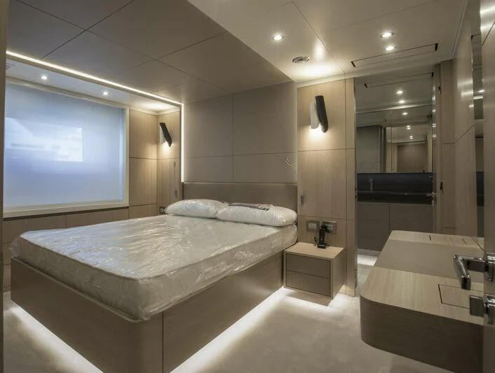 a modern bedroom with a large bed aboard ALEGRE Yacht for Sale
