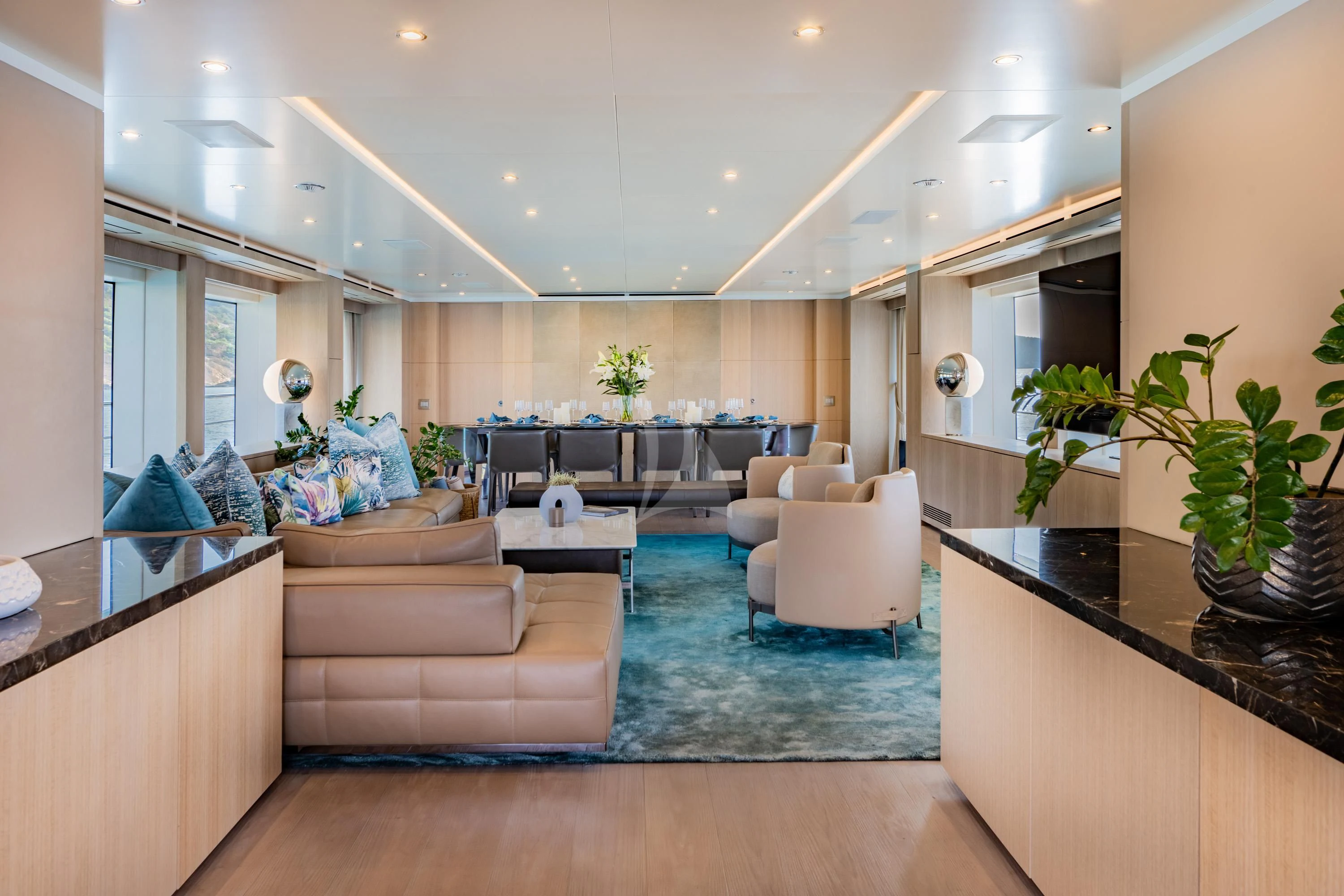 a living room with a couch and a table aboard ALEGRE Yacht for Sale