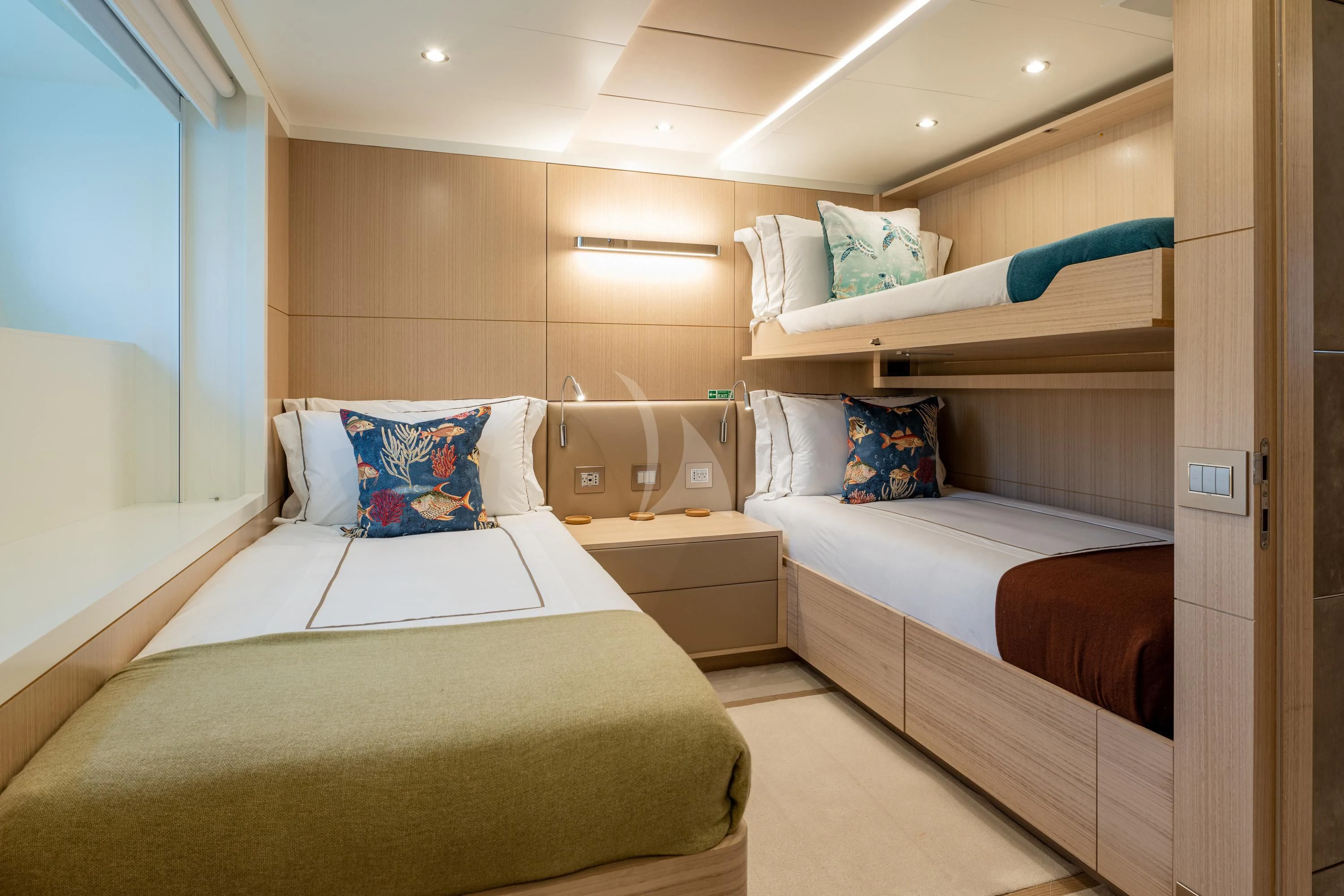 a room with beds and a window aboard ALEGRE Yacht for Sale