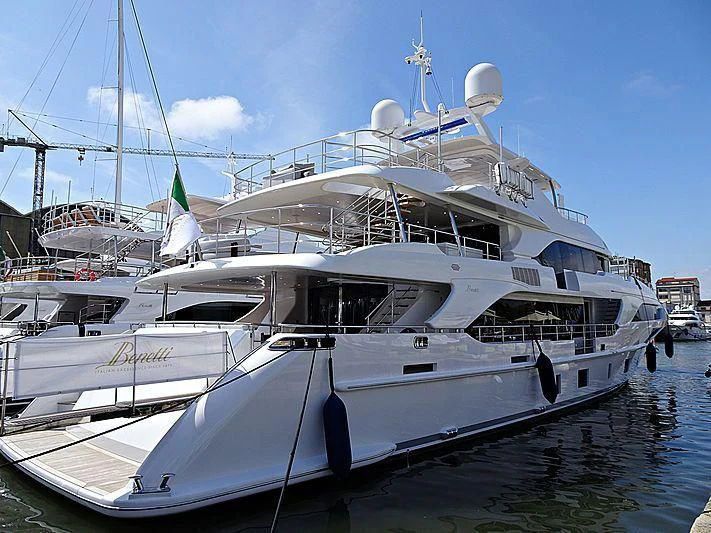 a large white boat in a harbor aboard ALEGRE Yacht for Sale