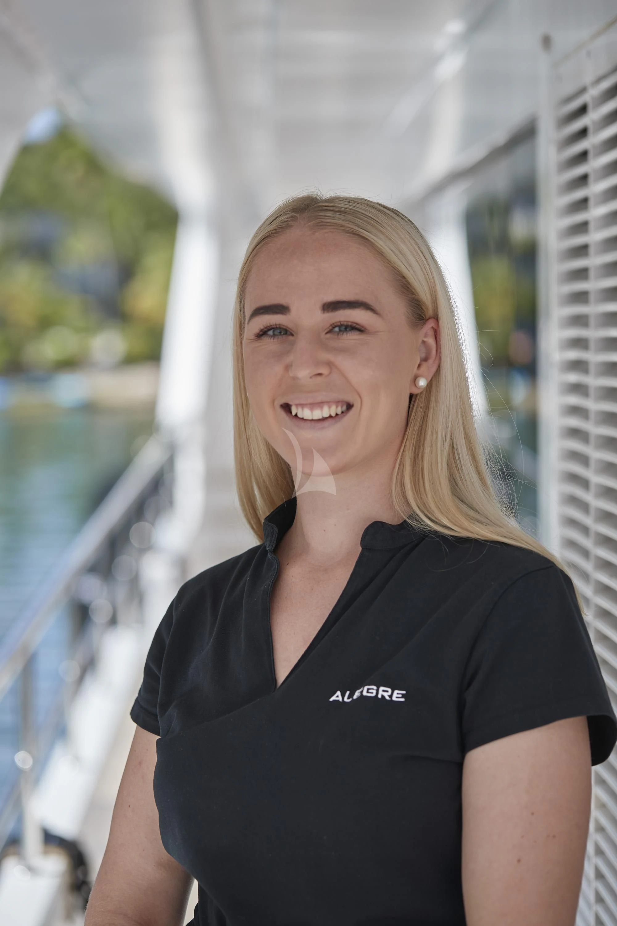 a woman smiling for the camera aboard ALEGRE Yacht for Sale