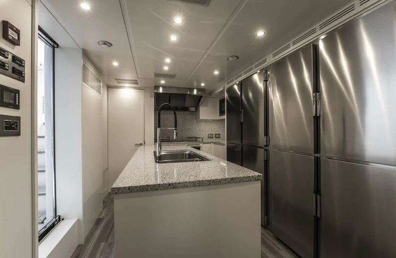 a kitchen with stainless steel appliances aboard ALEGRE Yacht for Sale