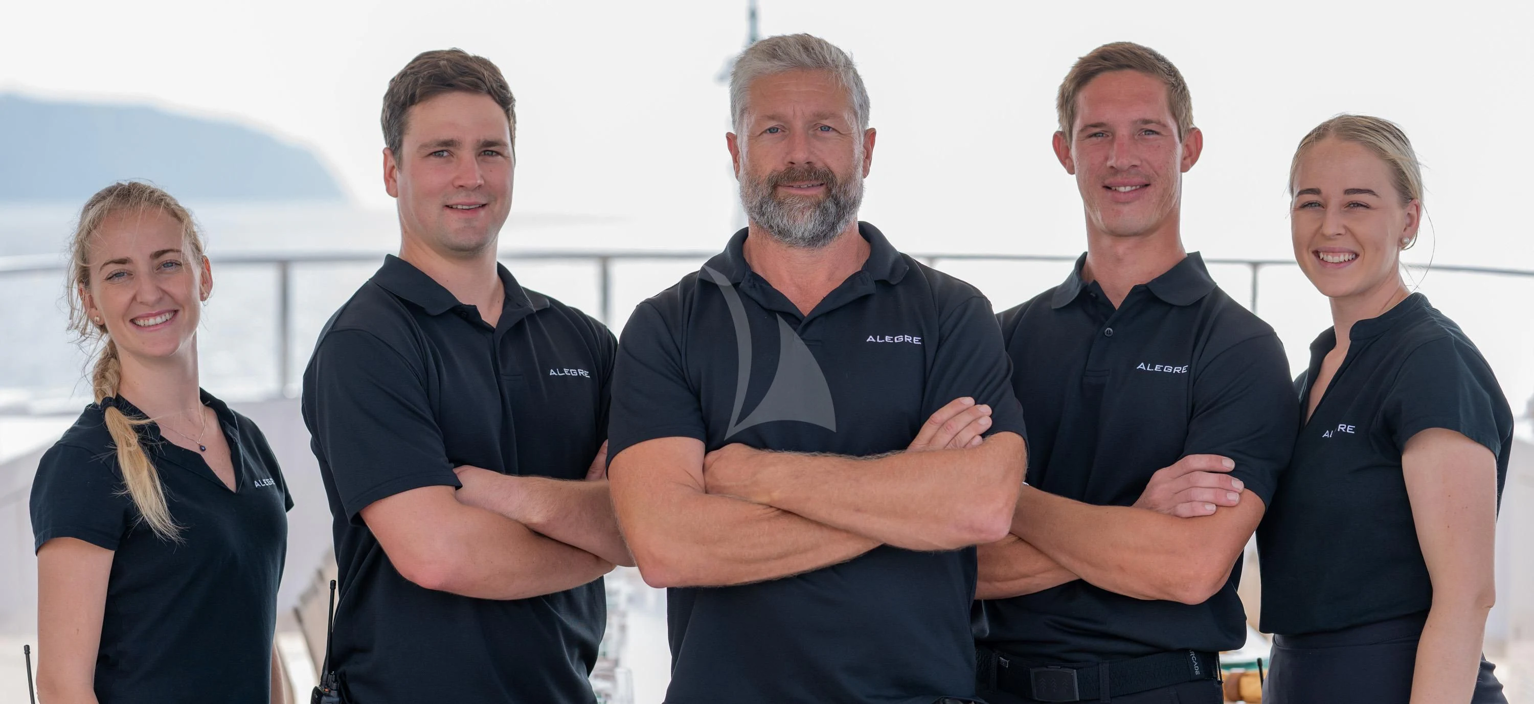 a group of people posing for a photo aboard ALEGRE Yacht for Sale