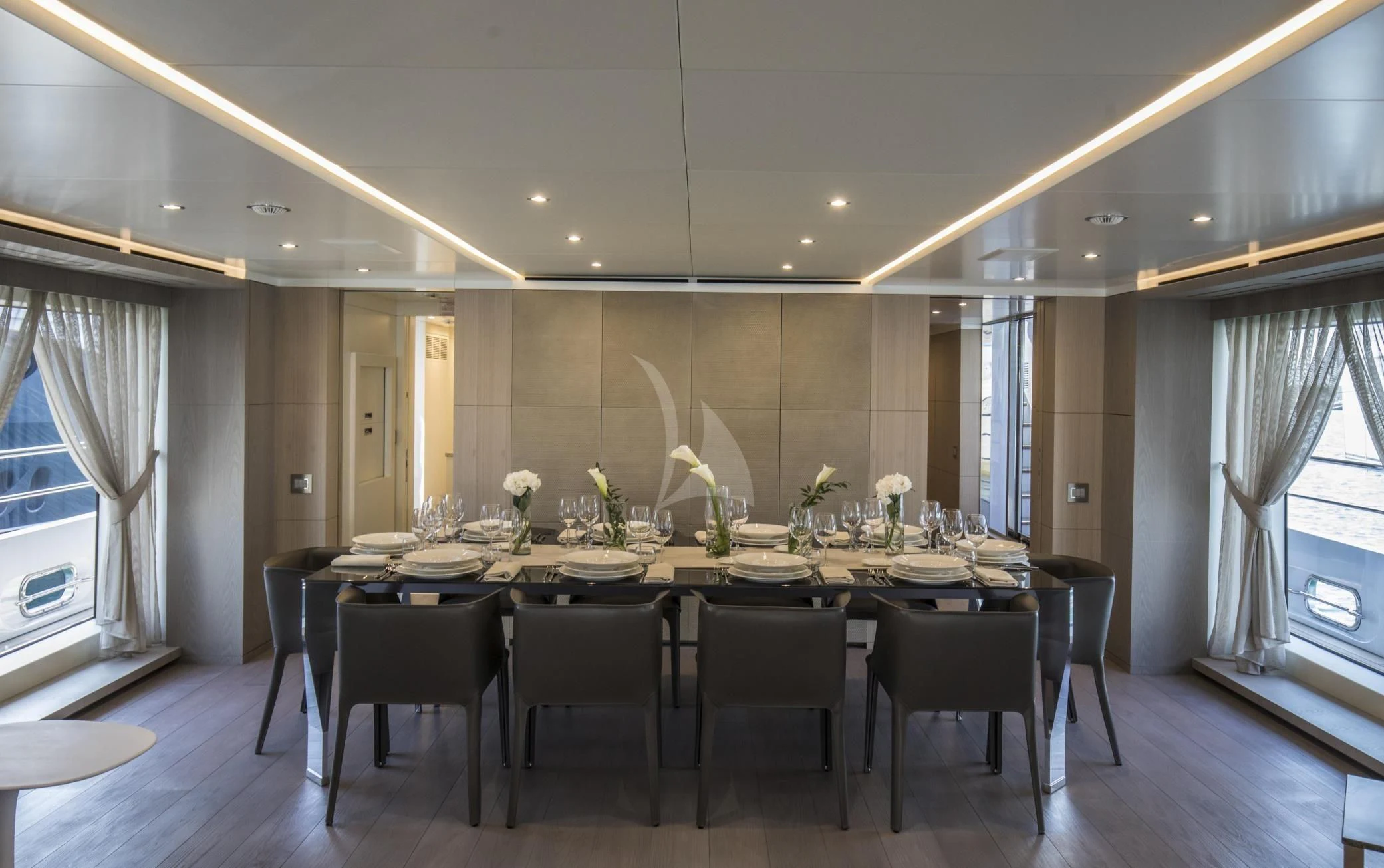 a large dining table in a large room aboard ALEGRE Yacht for Sale