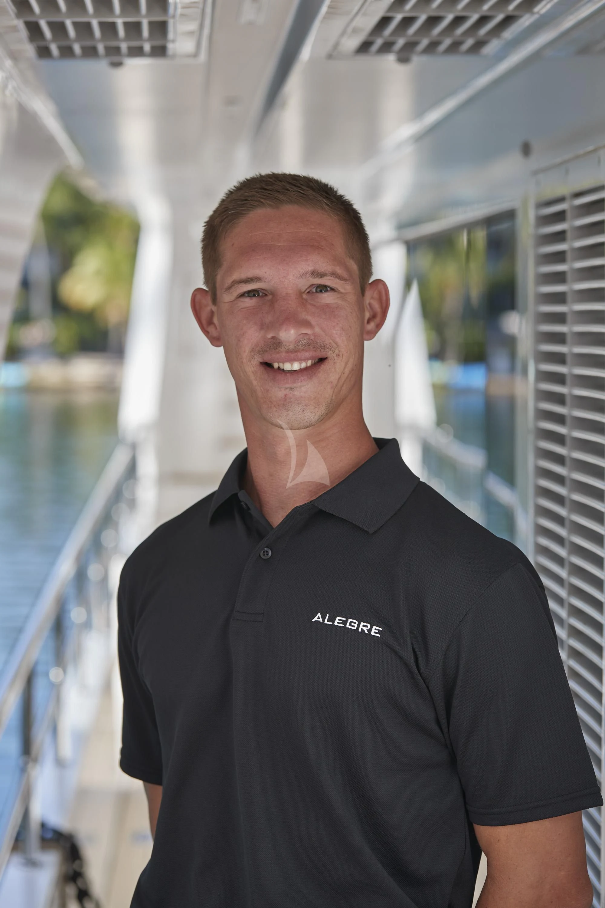 a man standing on a boat aboard ALEGRE Yacht for Sale