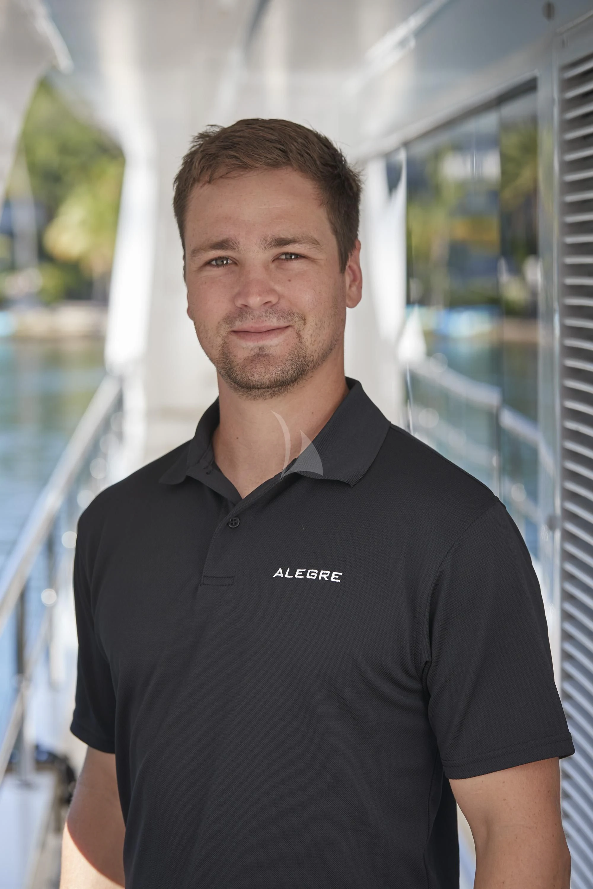 Nathan Beaver in a black shirt aboard ALEGRE Yacht for Sale