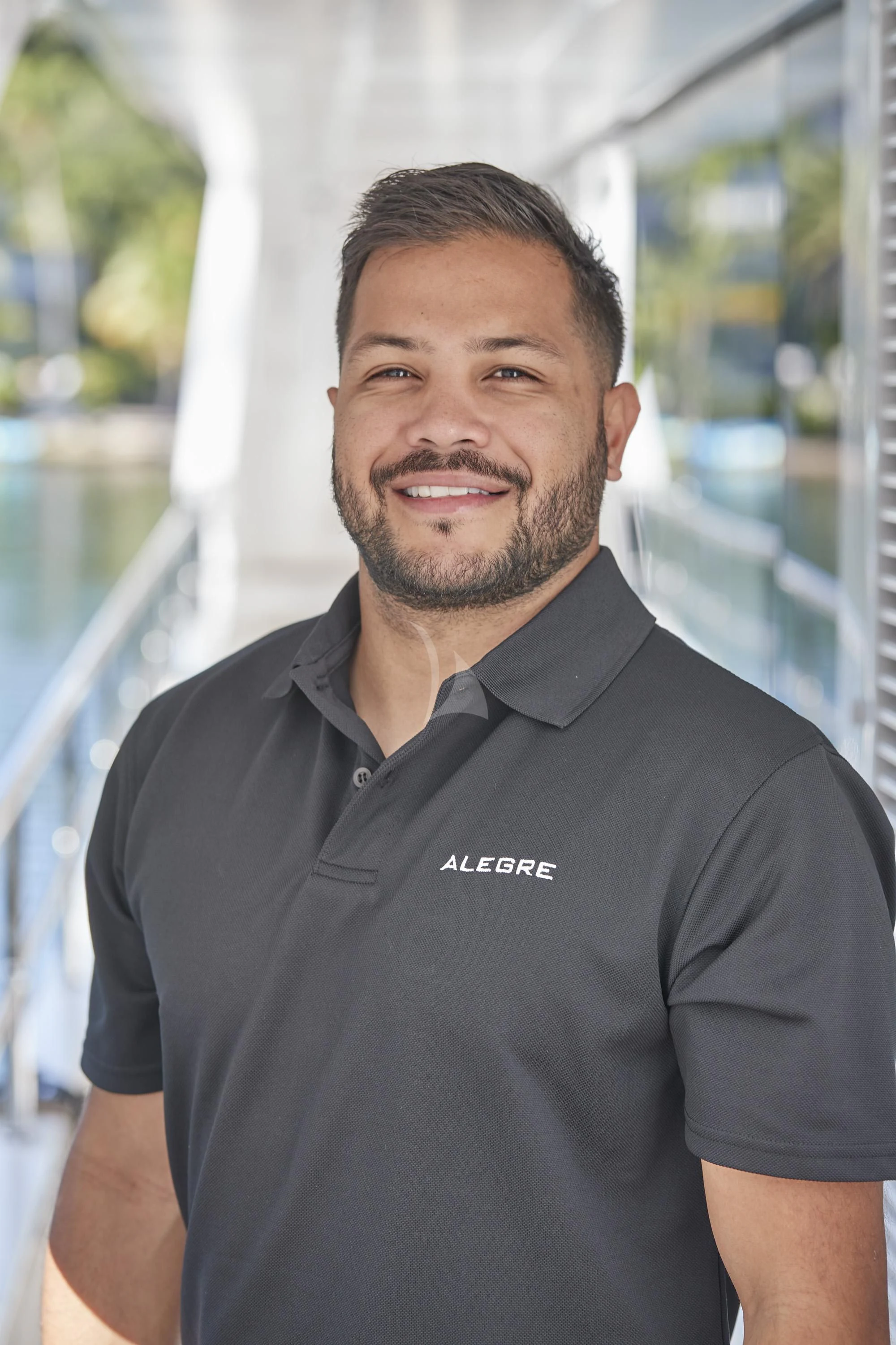 a man smiling for the camera aboard ALEGRE Yacht for Sale